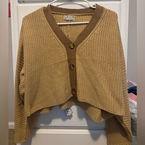 tan and brown sweater